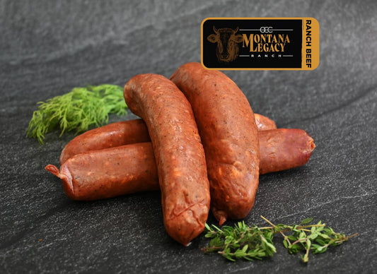 Salchicha/bratwurst ahumadas con chile y queso junto al fuego